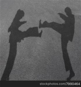 Karate children in a competitive combat as the cast shadow of a girl and boy fighting with leg kicks as martial arts for kid fitness and healthy activities symbol.