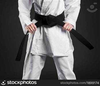 karate fighter proudly holding black belt. Resolution and high quality beautiful photo. karate fighter proudly holding black belt. High quality beautiful photo concept