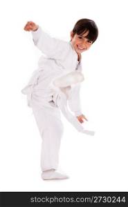 Karate kid kicking over isolated white background