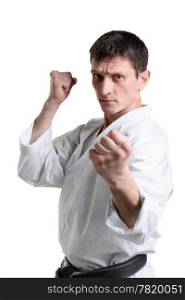 Karate. Man in a kimono with a white background