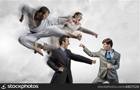 Karate man in white kimino. Young determined karate man fighting with team of businesspeople