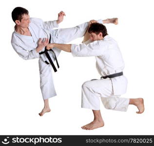 Karate. Men in a kimono with a white background. Battle sports capture
