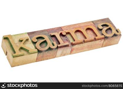 karma word - isolated text in letterpress wood type printing blocks stained by color inks