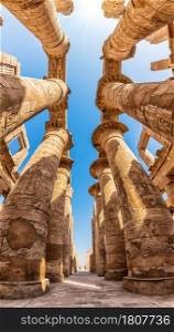 Karnak Hall Pillars and the blue sky of Luxor, Egypt.. Karnak Hall Pillars and the blue sky of Luxor, Egypt