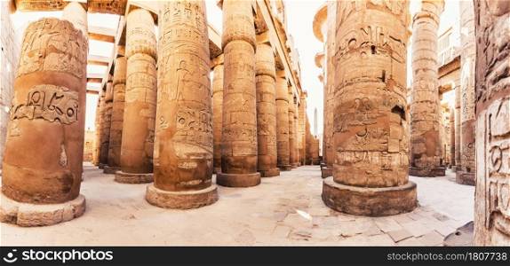 Karnak Temple columns with ancient carvings, Luxor, Egypt.. Karnak Temple columns with ancient carvings, Luxor, Egypt