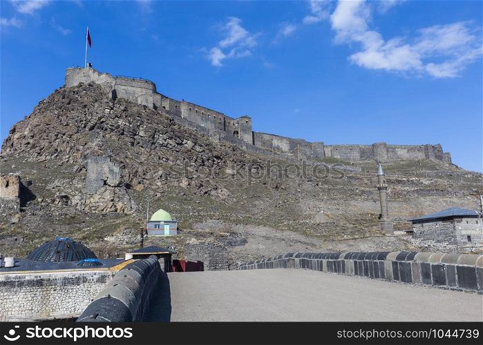 kars Castle and walls with blue sky in Turkey