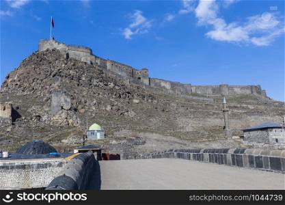 kars Castle and walls with blue sky in Turkey