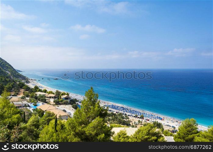 Kathisma Beach, Lefkada Island, Greece. Kathisma Beach, Lefkada Island, Greece - August 31 2016: . Kathisma beach lies on the western coast of Lefkada island and is a long beach with white sand and turquoise waters.