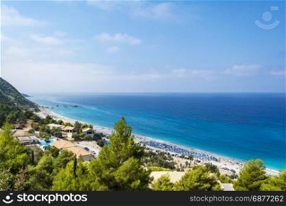 Kathisma Beach, Lefkada Island, Greece. Kathisma Beach, Lefkada Island, Greece - August 31 2016: . Kathisma beach lies on the western coast of Lefkada island and is a long beach with white sand and turquoise waters.