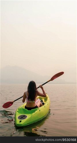 Kayak Water Sports at Lake. Kayakers enjoying the beautiful sunrise walks by sea kayak or canoe at tropical bay. relaxing with boat