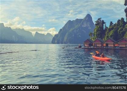 Kayaking on Cheo Lan lake. Khao Sok National Park. Thailand. (Vintage filter effect used)