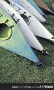 Kayaks in a Row on Land