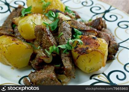 kazan-kebab - fried meat and potatoes .Central Asian cuisine
