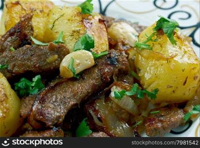 kazan-kebab - fried meat and potatoes .Central Asian cuisine