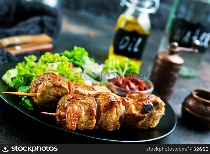 kebab and vegetable salad on plate., fried meat