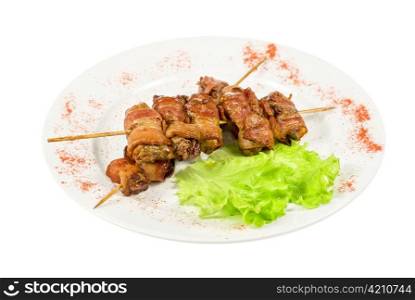 Kebab from chicken liver wrapped with bacon and garlic sauce