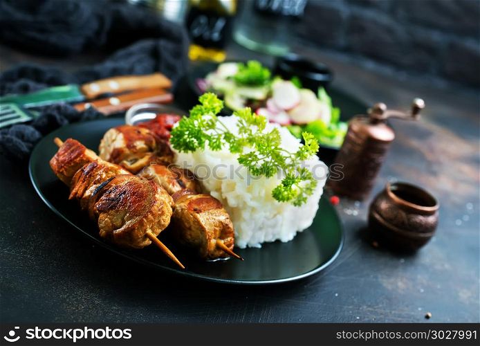 kebab. kebab with boiled rice on plate, stock photo