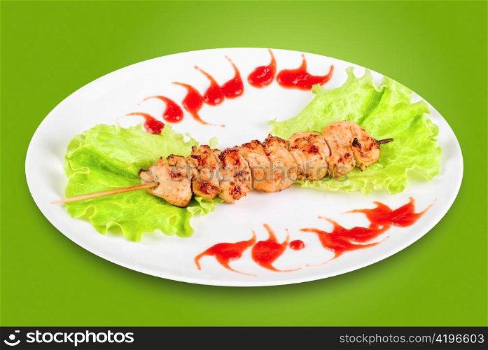 Kebab of chicken meat and vegetables isolated on a white background