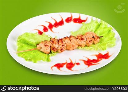 Kebab of chicken meat and vegetables isolated on a white background