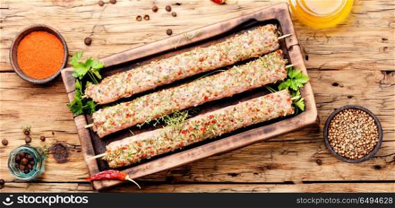 Kebab of lamb with herbs. Raw turkish traditional dish meat kebab with herbs and spices.Caucasian kitchen