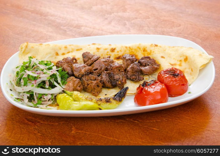 Kebab served in the plate