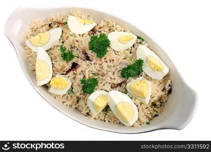 Kedgeree, flakes of smoked herring baked with rice, milk, stock, pepper and parsley, and served with hard-boiled eggs. A Scottish dish that was a particular favourite in British India.
