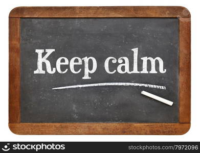 Keep calm advice or reminder - white chalk text on a vintage slate blackboard