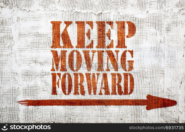 Keep moving forward - red graffiti sign with arrow on a white stucco wall