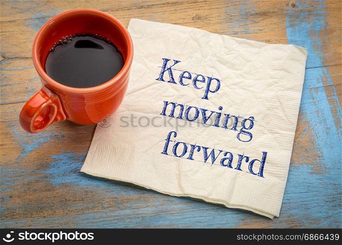 Keep moving forward reminder or advice - handwriting on a napkin with a cup of espresso coffee