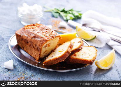 keks with lemon on plate and on a table