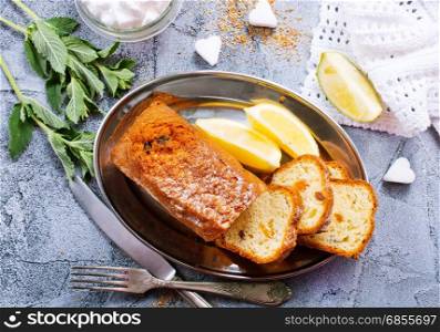 keks with lemon on plate and on a table