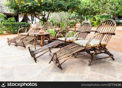 Kenya. Elegant furniture made of wood in an African garden