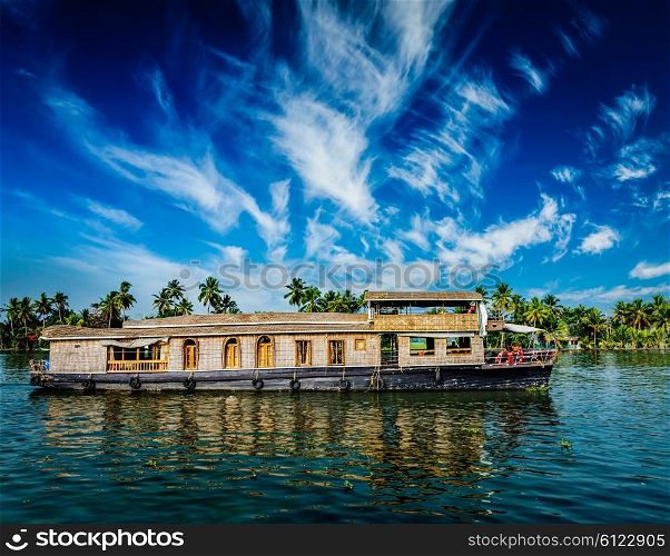 Kerala India travel background - houseboat on Kerala backwaters. Kerala, India