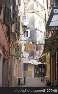 KERKYRA, CORFU, GREECE - JULE 10, 2021   small narrow streets of historic Center old town of Kerkyra 