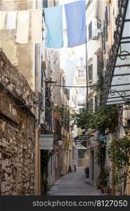 KERKYRA, CORFU, GREECE - JULE 10, 2021   small narrow streets of historic Center old town of Kerkyra 