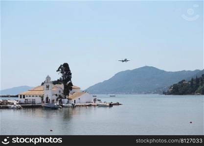 KERKYRA, CORFU, GREECE - JULE 11, 2021   view of Vlacherna Monastery Kanoni and Mouse islands 