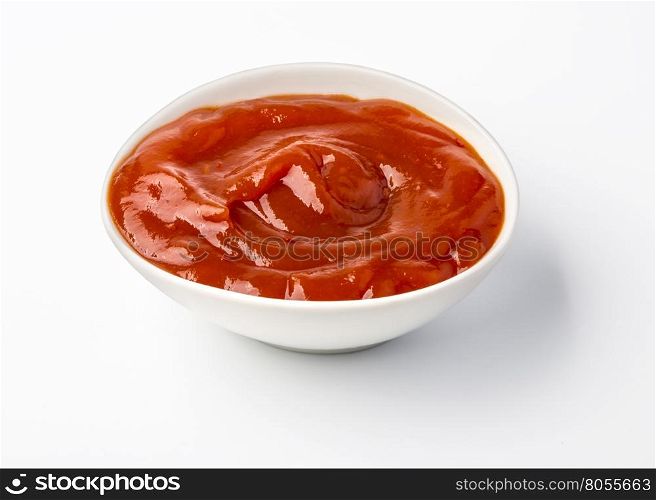Ketchup in bowl isolated on white background. Portion of tomato sauce. With clipping path.