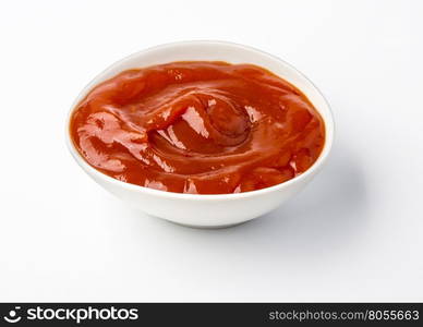 Ketchup in bowl isolated on white background. Portion of tomato sauce. With clipping path.