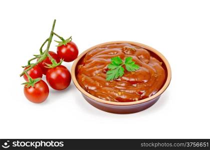 Ketchup in pottery with tomatoes and parsley isolated on white background