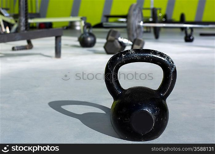 Kettlebell at crossfit gym with lifting bars in background