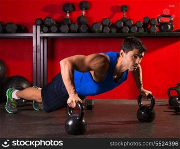 Kettlebells push-up man strength pushup exercise workout at gym