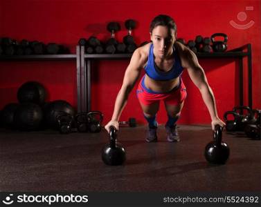 Kettlebells push-up woman strength pushup exercise workout at gym