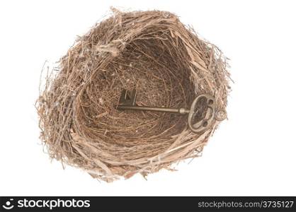Key in bird nest isolated on white background
