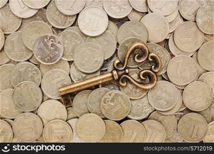 key on a heap of coins