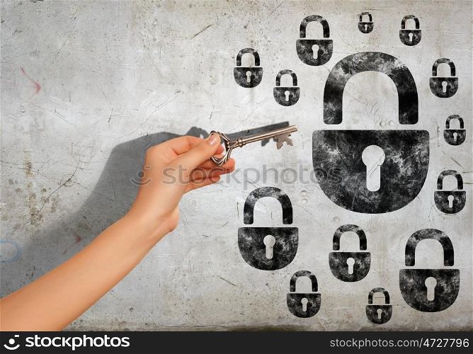 Key to problem. Close up image of human hand holding key