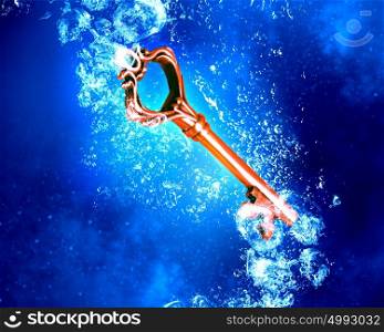 Key under water. Key sinking in clear blue crystal water