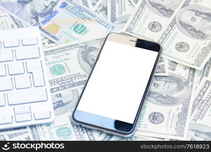 keyboard and modern phone on money background, copy space on screen. keyboard and phone