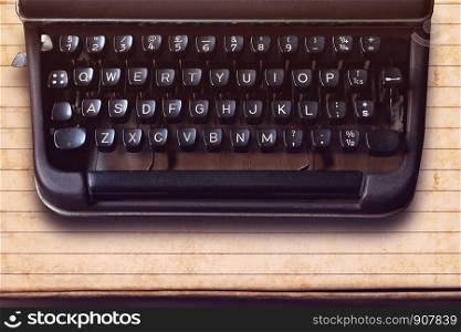 Keyboard on a vintage typewriter on paper background