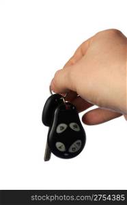 Keys from the car with signalling. The isolated sheaf of keys from the car in a hand