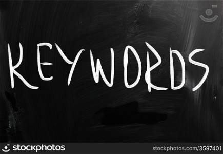 ""Keywords" handwritten with white chalk on a blackboard"